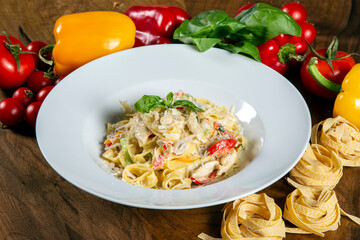Tagliatelle pasta with pesto sauce and parmesan.