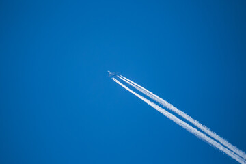 Plane Flighting Through the sky with Chemical Trail