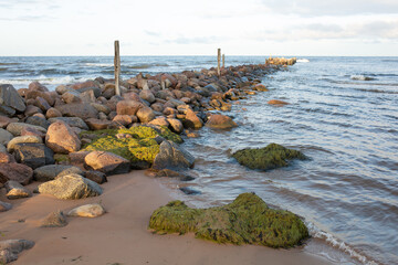 
Pile of stones, entrance to the sea
