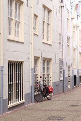 Obraz premium White Houses with a Bicycle in Amsterdam