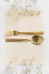 card with flowers and silverware