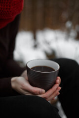 mug with coffee in hand in winter