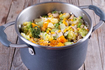 Vegetable stew in a saucepan on a table
