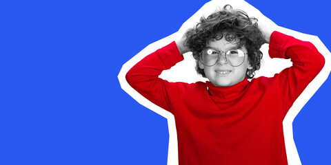 Portrait of young curly boy in red wear on blue and white studio background. Childhood, expression, education, fun concept. Collage in magazine style. Flyer with trendy colors, copyspace for design.