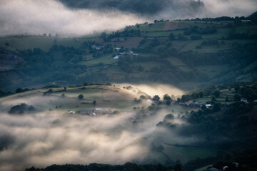 Stagnant fogs in the lowlands between hills in rural Galicia