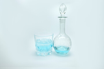 blue alcoholic drink in a decanter. Cocktail with blue gin , tonic