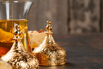 Glass cup of tes and turkish desserts on table