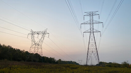 Fototapeta premium Power lines are held up by transmission towers.