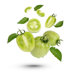 Fresh green tomatoes with leaves on white background