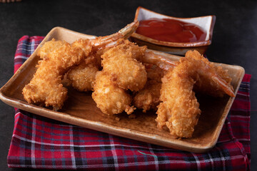 Battered prawns fried in brown and ketchup