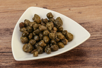 Tasty capers in the bowl