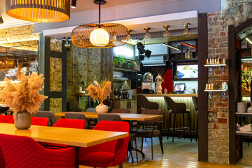 Fototapeta na wymiar Interior of a modern cozy italian restaurant