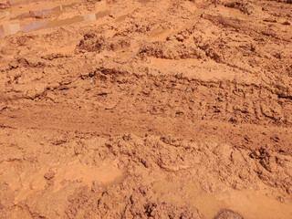 The mark of heavy vehicle tires that have gone through a muddy soil. 