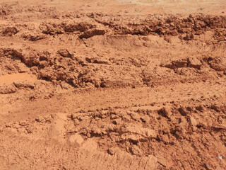 The mark of heavy vehicle tires that have gone through a muddy soil. 