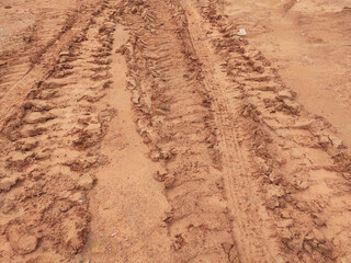 The mark of heavy vehicle tires that have gone through a muddy soil. 