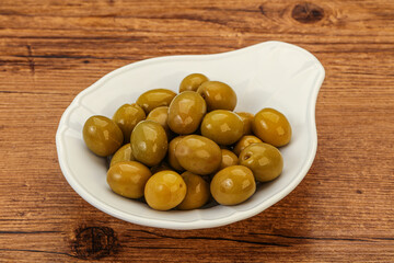 Green pickled olives in the bowl