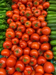 tomatoes in seller's case, top view.