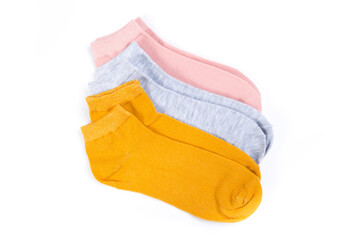 several pairs of short socks on a white background, top view