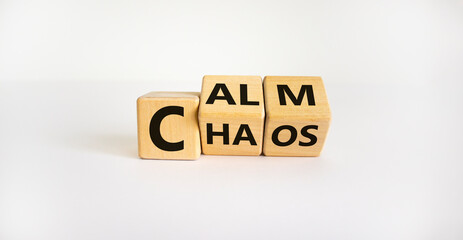 Stop chaos, time to calm. The words 'chaos' and 'calm' on wooden cubes. Beautiful white background, copy space. Business and chaos or calm concept. - obrazy, fototapety, plakaty