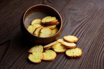 Bruschette chips in bowl, dry slices of baked bread, beer snacks