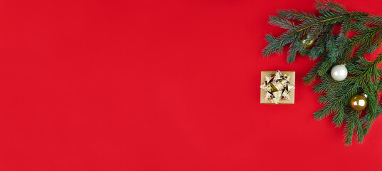 Holiday banner Merry Christmas and Happy New Year. Xmas design with gift, fir branches, balls and...