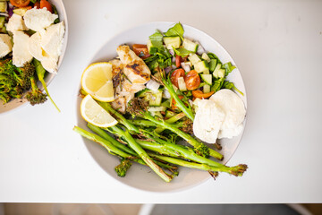 Asparagus and chicken dishes with tomato and zucchini slices