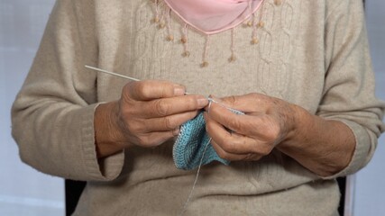 hands of an elderly lady crochet cotton - made in Italy, Italian textile manufacturer