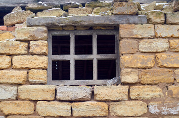 Fototapeta na wymiar Wooden window of an abandoned warehouse