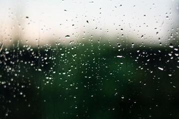 Naklejka na ściany i meble Raindrops in a window