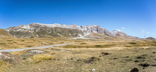 road bending on flat upland at Campo Imperatore,  near S.Egidio, Abruzzo, Italy