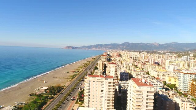 Mahmutlar , Antalya Province in Turkey. Aerial flight of beautiful town overwashed by Mediterranean sea and surrounded by Taurus Mountains.
