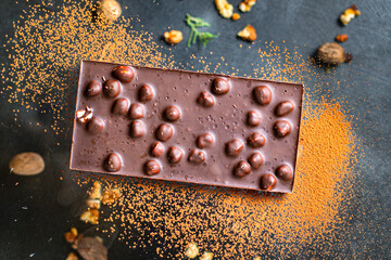 chocolate with nuts hazelnut sweet dessert snack ready to eat on the table healthy meal snack ingredient top view copy space for text food background rustic