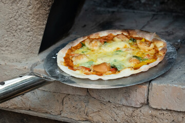 Homemade classic italian pizza. Chef makes homemade pizza on the holidays.