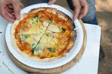 Homemade classic italian pizza. Chef makes homemade pizza on the holidays.