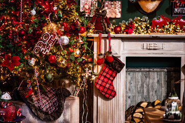 Colorful Christmas decor at the Maastricht Christmas Market. Gifts, fir tree branches, decorations and blurred glow of garlands. Christmas, winter, new year concept.