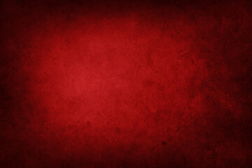 Red textured concrete background. Dark edges