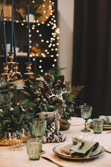 Festive kitchen in Christmas decorations. Christmas dining room. Beautiful New Year decorated classic home interior