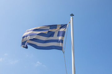 Fluttering in the wind Flag of Greece , Ios Island, Greece.