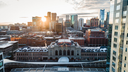 "Denver, CO USA - 11-29-2020: Aerial shot through the buildings of the downtown Denver skyline with the Union Station in the foreground."