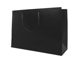 Profile view of black matte paper shopping bag mockup with black rope handle and isolated on white background