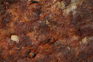 Burned frying pan texture.  Frying potatoes. The remains of food were burnt. Frying without oil.