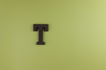 The letter of the alphabet T is made from milk chocolate