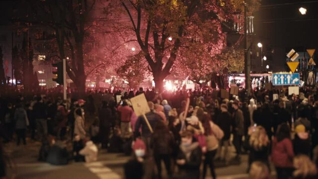Women's strike in Poland. Fighting against abortion ban. Red smoke and flares