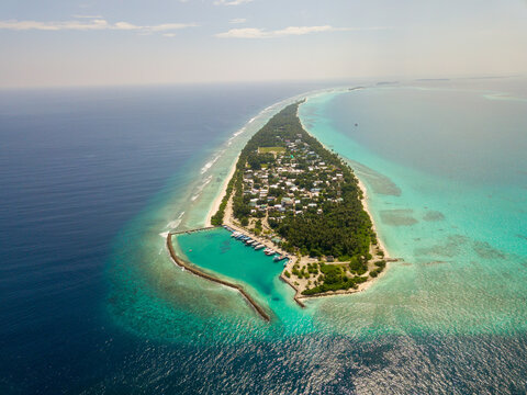 Aerial spherical panorama of tropical paradise beach on tiny Maldives island Dhigurah in Ari Atoll. Turquoise ocean, white sand, coconut palm trees.