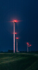 wind turbine farm at night
