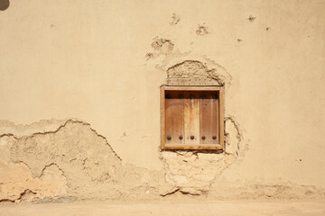 An old window on the walls of the houses of the city of Al-Hofuf in Al-Ahsa. Saudi Arabia .