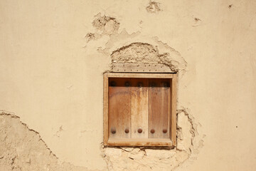 An old window on the walls of the houses of the city of Al-Hofuf in Al-Ahsa. Saudi Arabia .