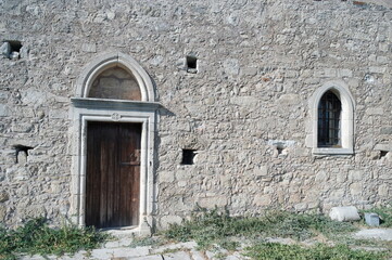 Fototapeta na wymiar stone walls of an old chapel in Greece