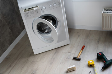 broken washing machine in the apartment