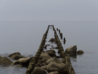 Old wooden breakwater stretching to the horizon. Svetlogorsk Kaliningrad region Russia
